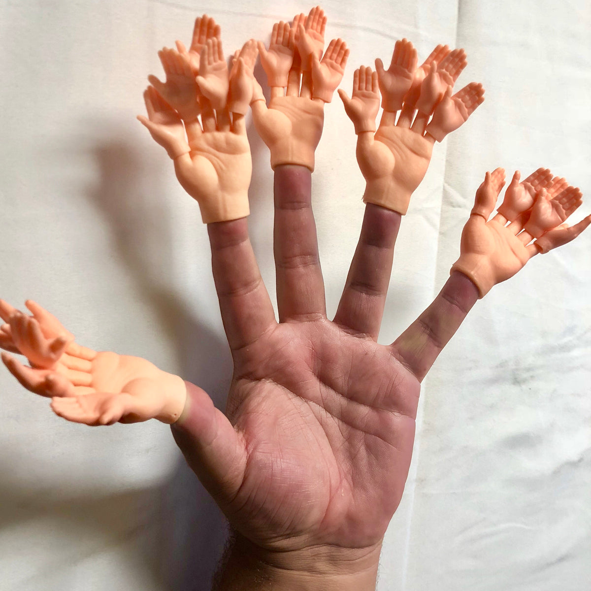 Hand with Mini-Hands on Finger
